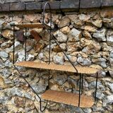 Wall shelf made of rattan and wrought iron