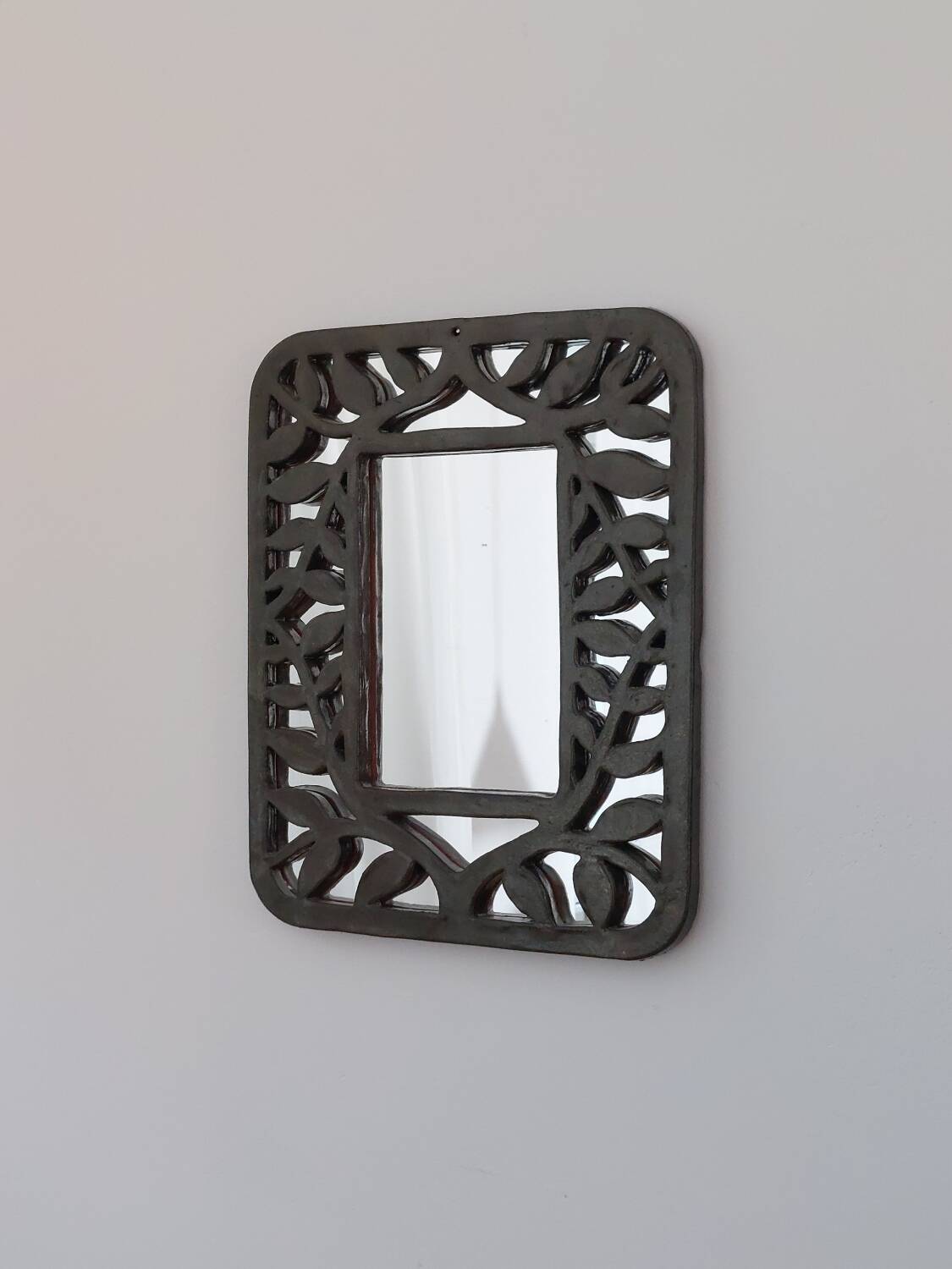Unique vintage floral ceramic wall mirror by an artist