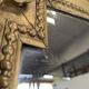 Large gilded wooden mirror in Louis XVI style from the late 19th century.