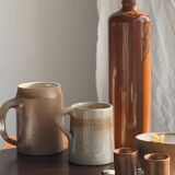 Large antique stoneware bottle with a small cork stopper