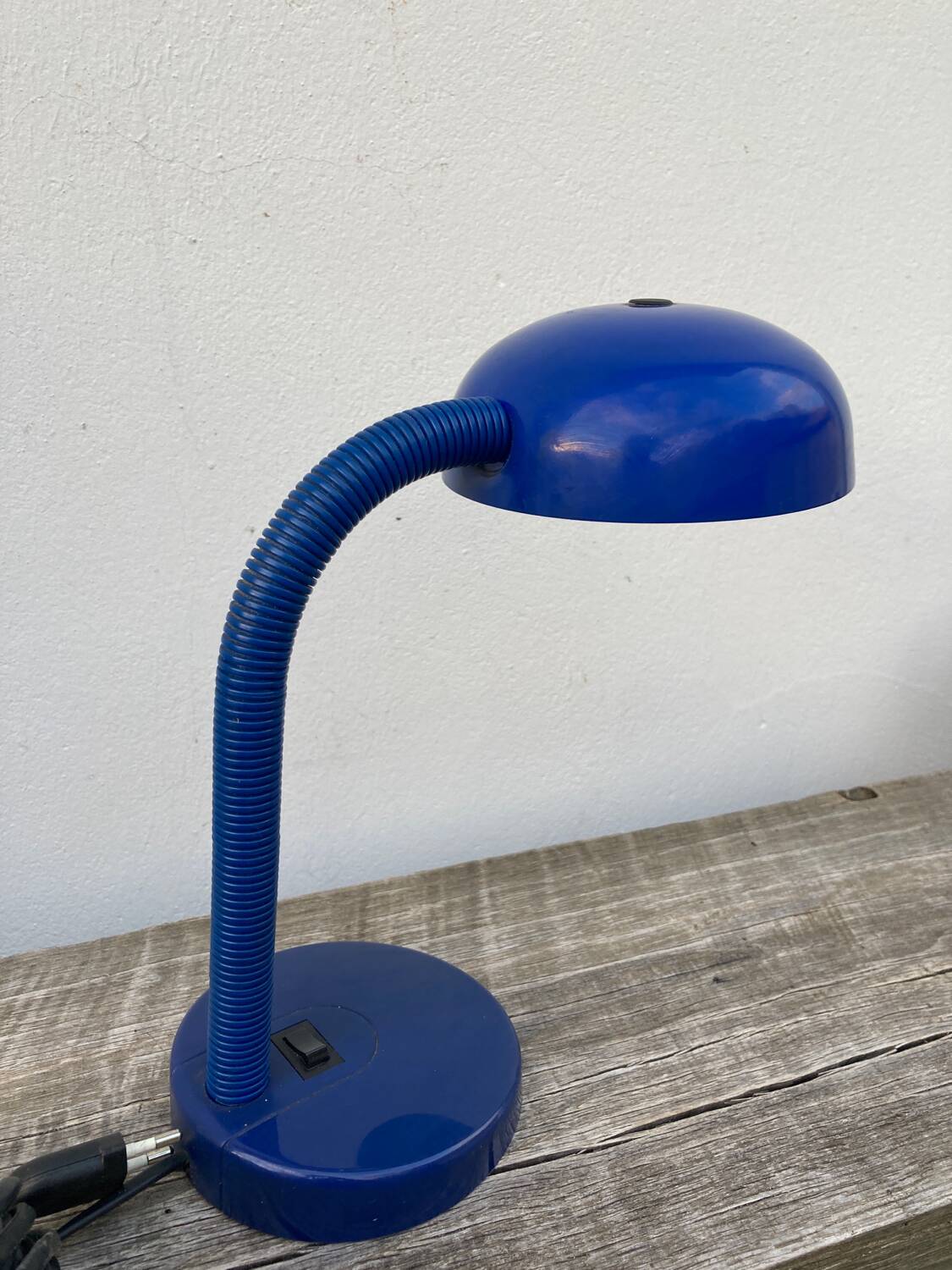 Articulated blue metal bedside lamp