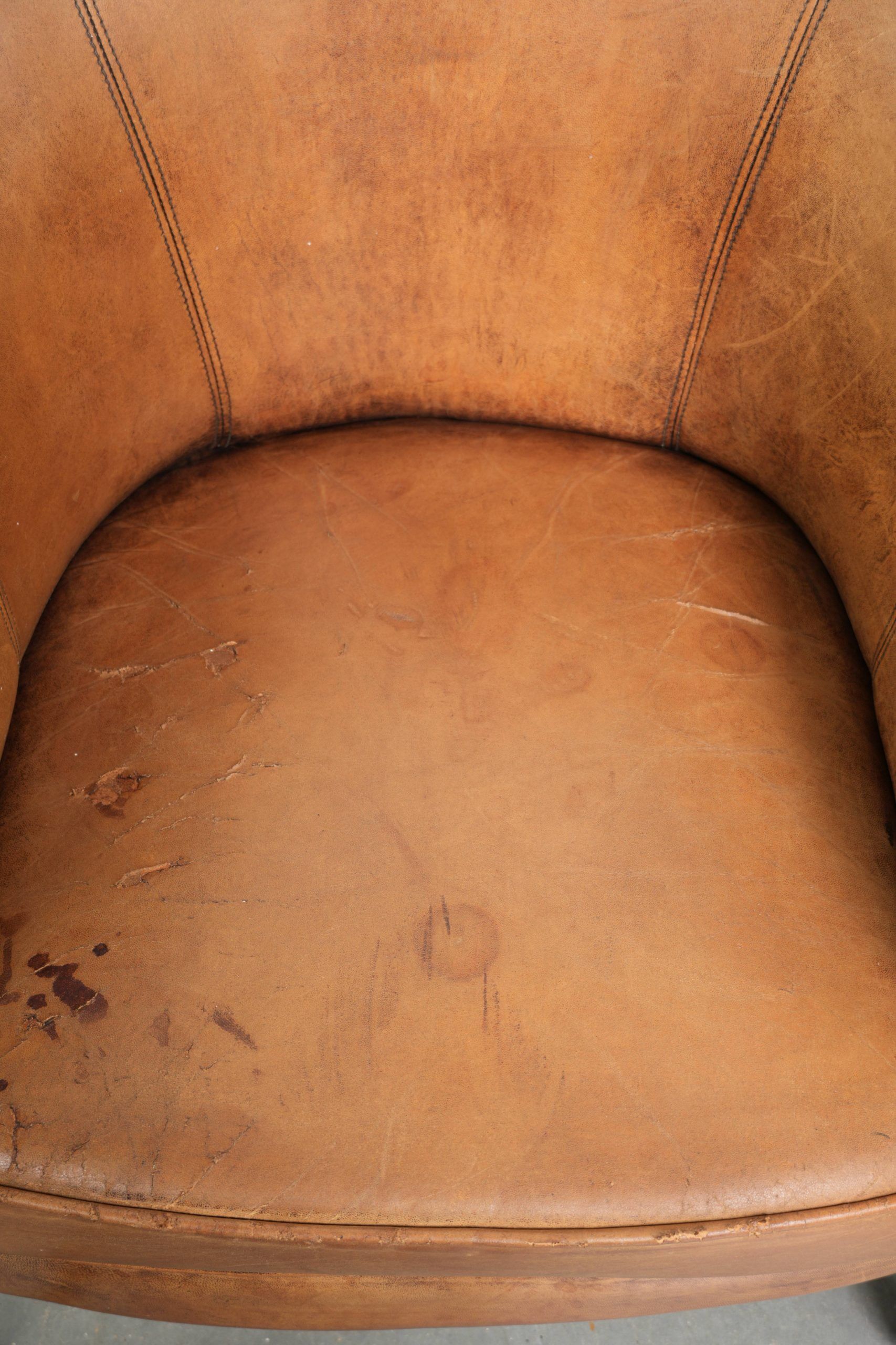 Set of two vintage sheepskin club armchairs with a beautiful light colour
