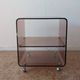 Pair of vintage smoked plexiglass bedside tables or accent furniture.