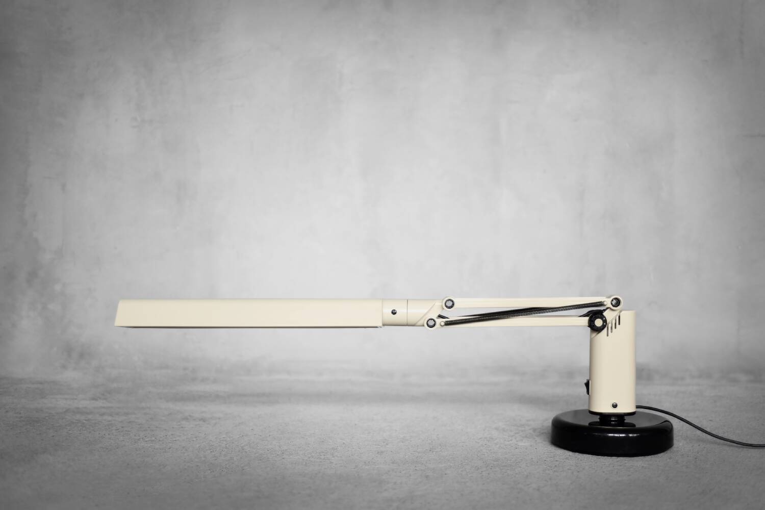 Beige plastic table lamp Lucifer, mid-century modern Scandinavian style.