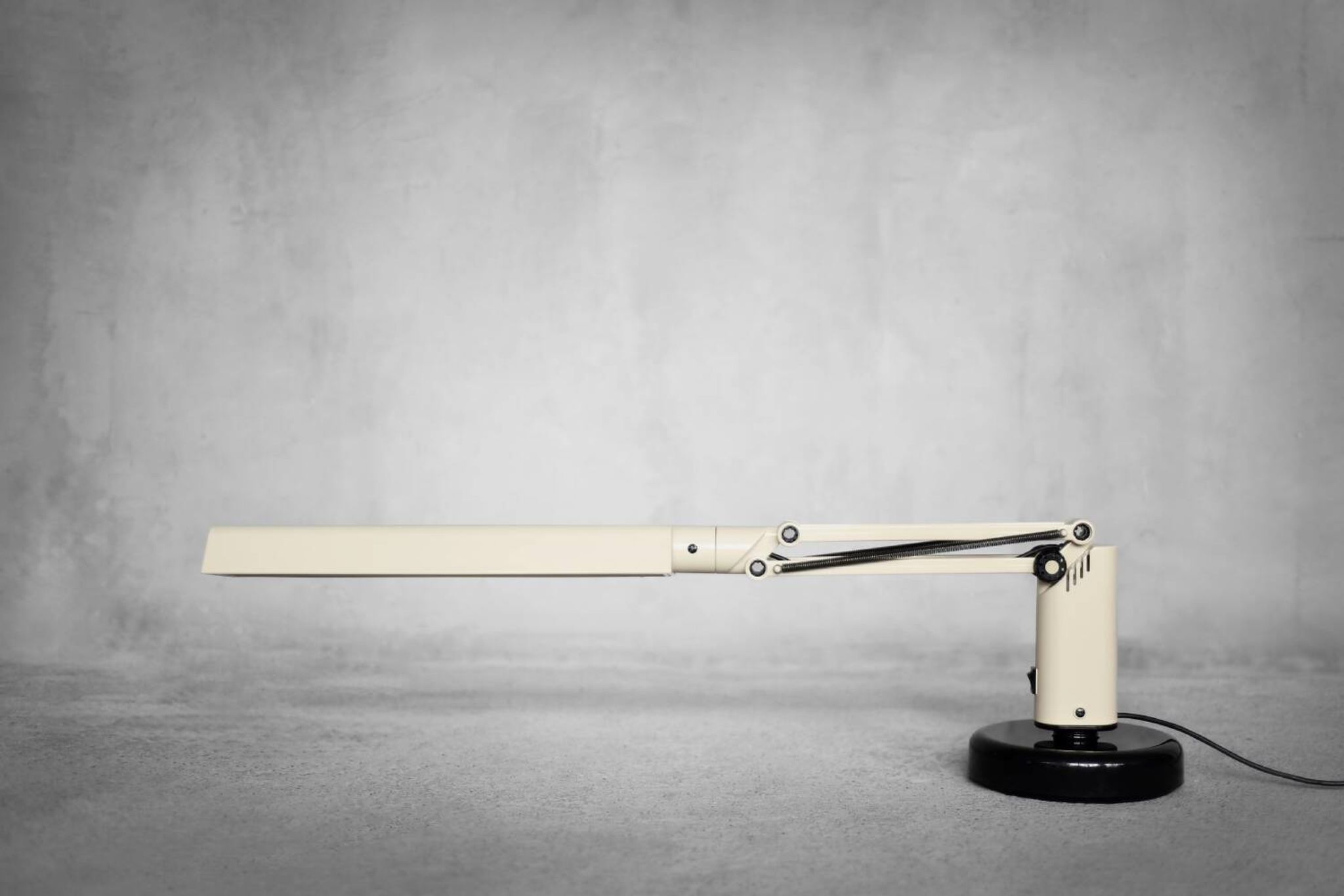 Beige plastic table lamp Lucifer, mid-century modern Scandinavian style.