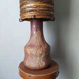 Table lamp with terracotta base and resin shade.