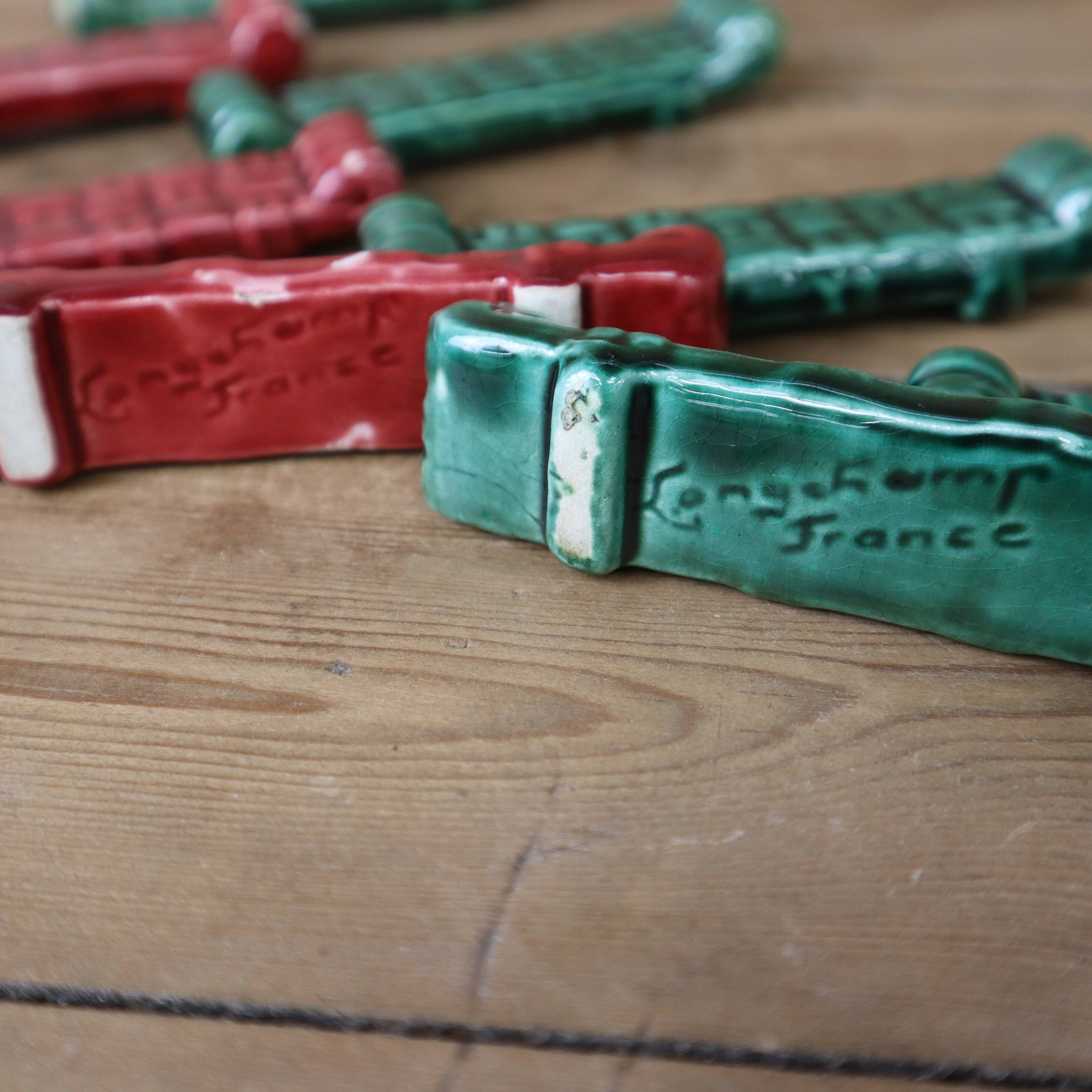 Set of 8 lonchamp france knife holders in barbotine