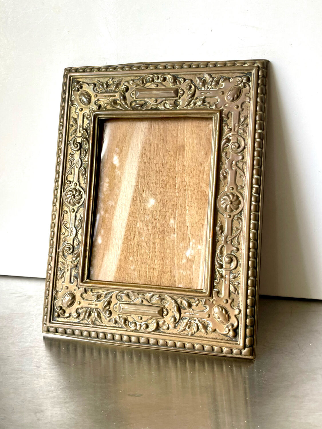 Antique brass metal picture frame in baroque style
