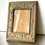 Antique brass metal picture frame in baroque style
