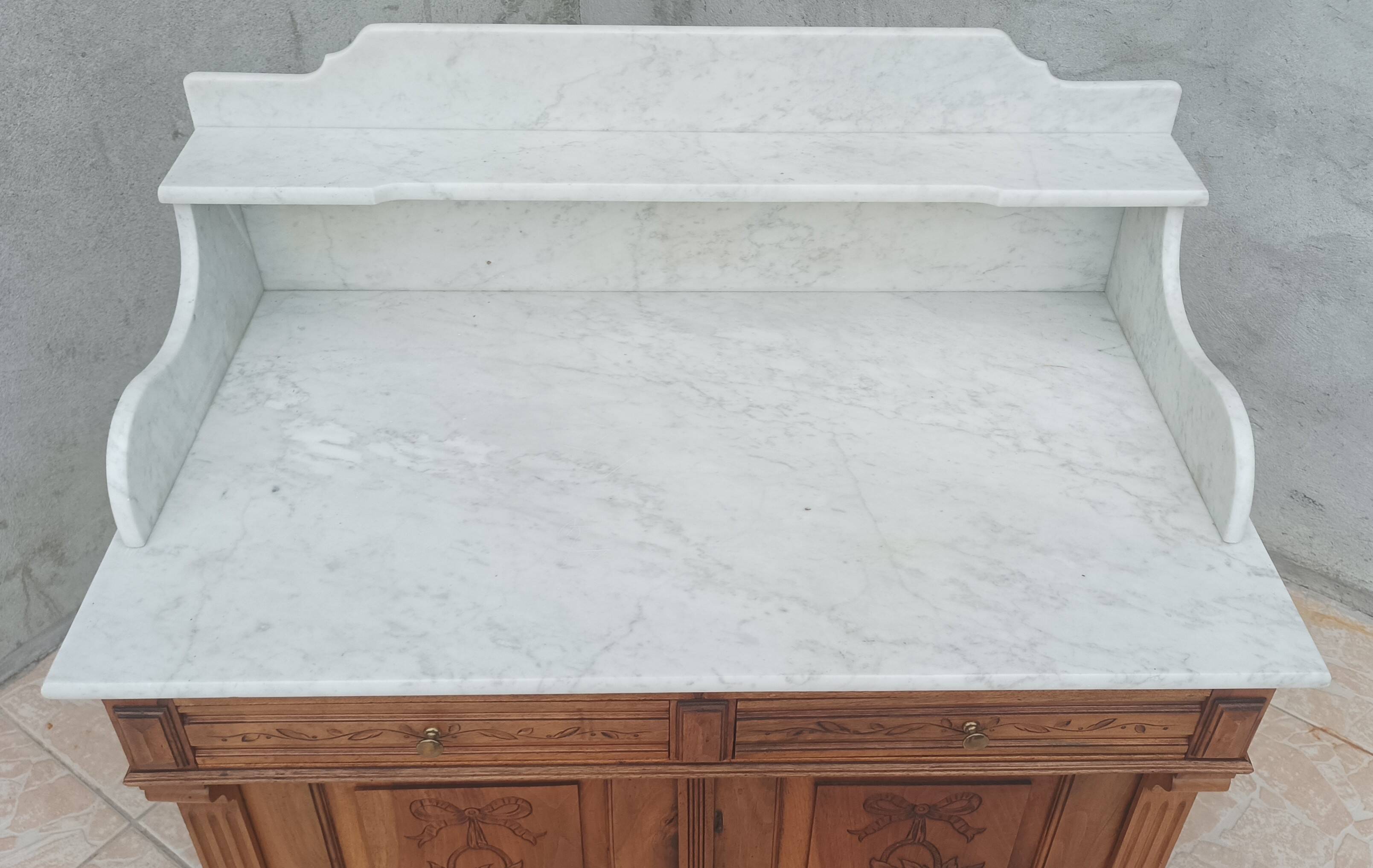 Antique walnut and white marble bathroom cabinet