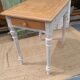 Antique drawer table with a patina.