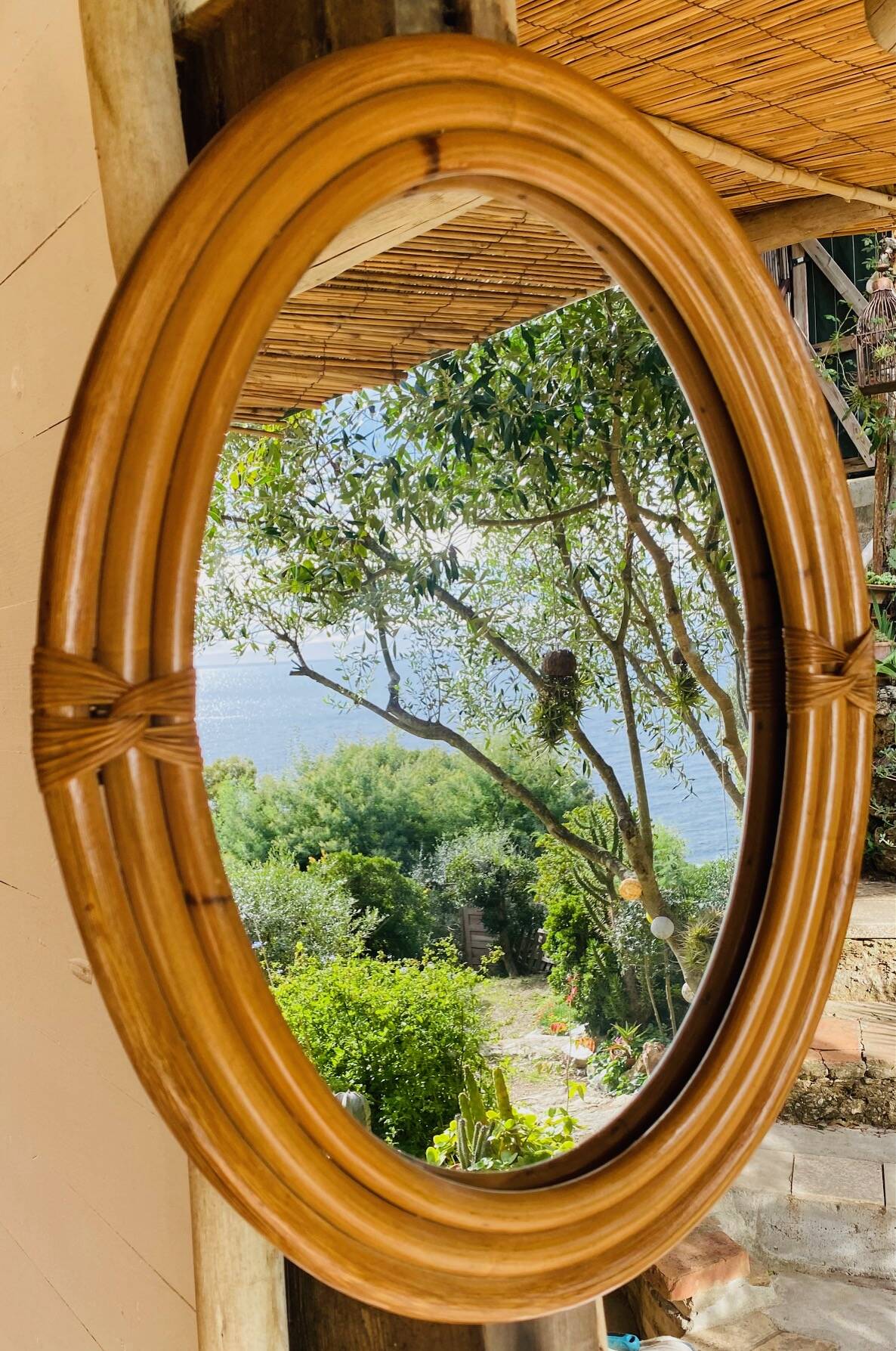 Vintage oval rattan mirror