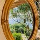 Vintage oval rattan mirror