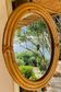 Vintage oval rattan mirror