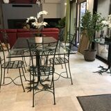Wrought iron table with tree sculpture and glass top