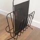 Black lacquered metal and perforated metal magazine rack designed by Mathieu Matégot 50.