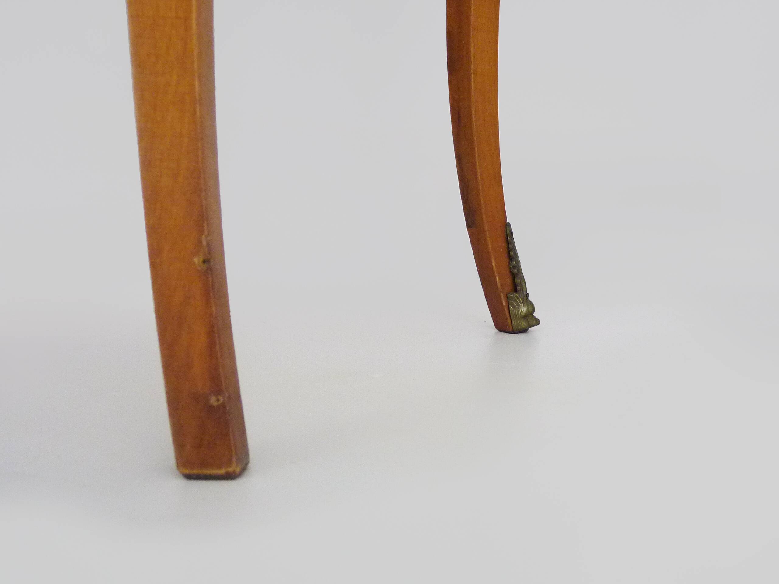 Baroque style wooden chest of drawers with bronze frieze.