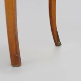 Baroque style wooden chest of drawers with bronze frieze.