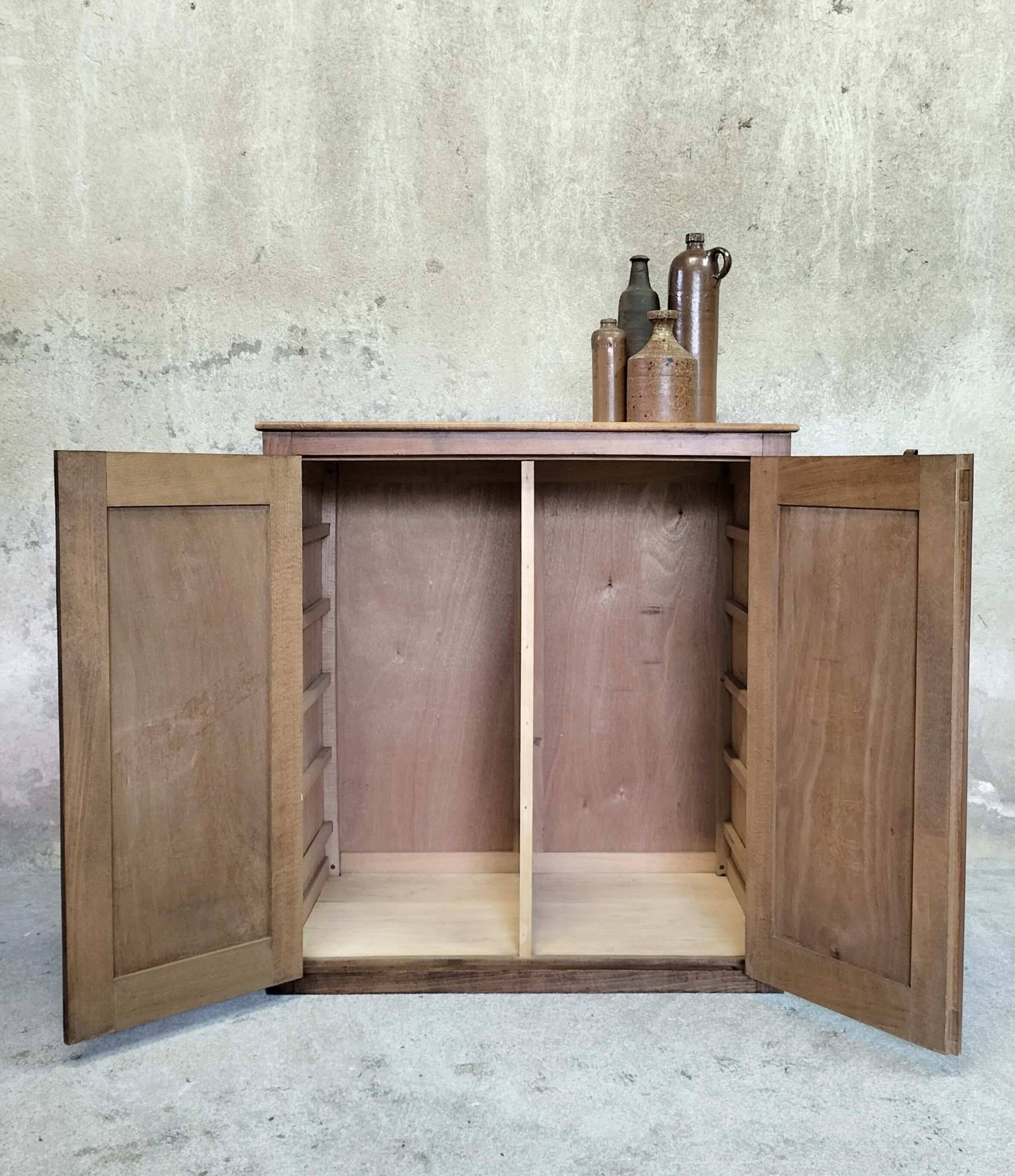 Small wooden sideboard with two doors.