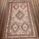 Hand-knotted silk carpet purchased in Iran – geometric and animal design –