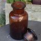 Jar bottle of herbalism pharmacy in amber colored glass art deco