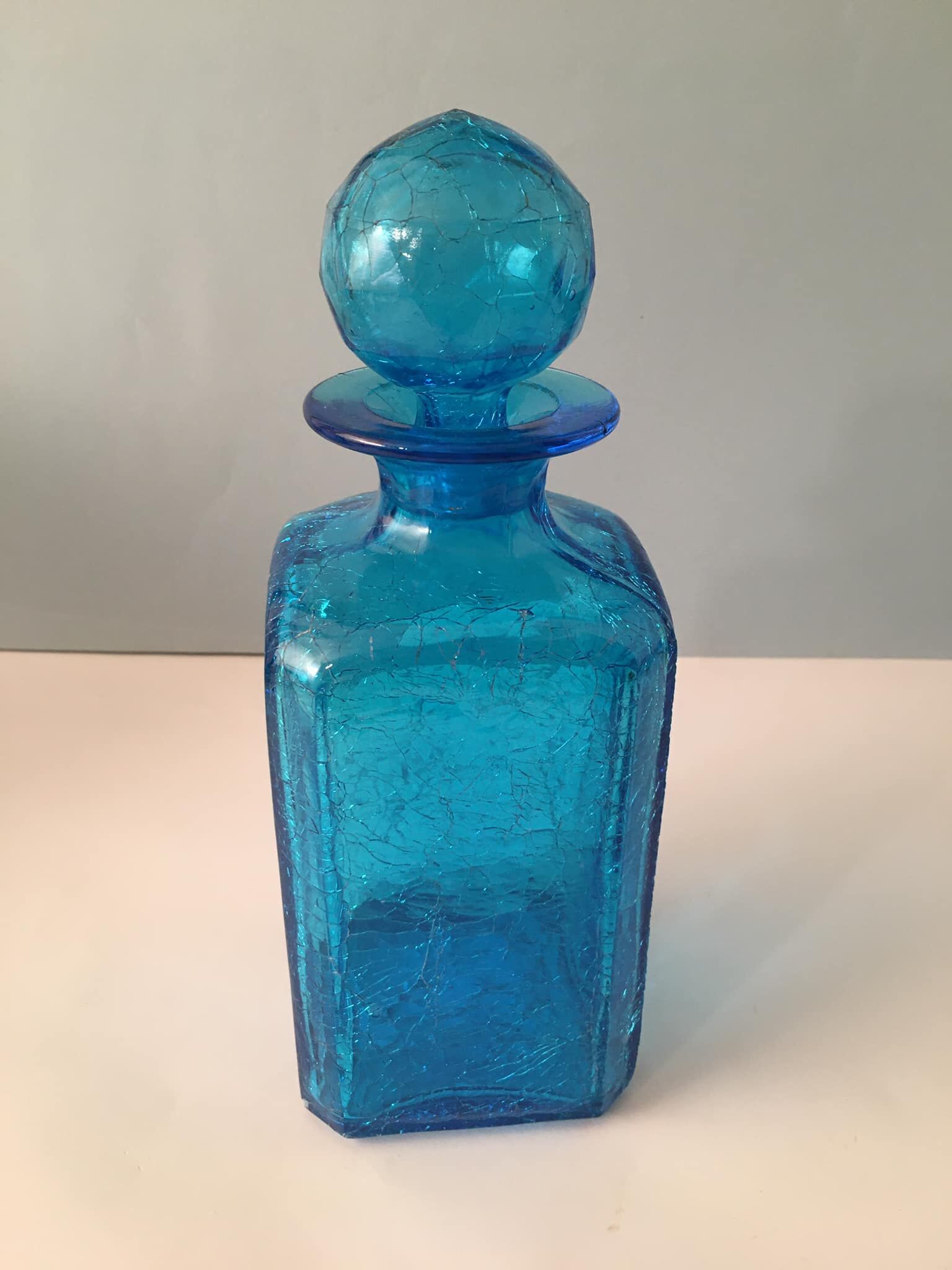 Blue glass bottle with glass cap