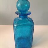 Blue glass bottle with glass cap