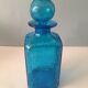 Blue glass bottle with glass cap