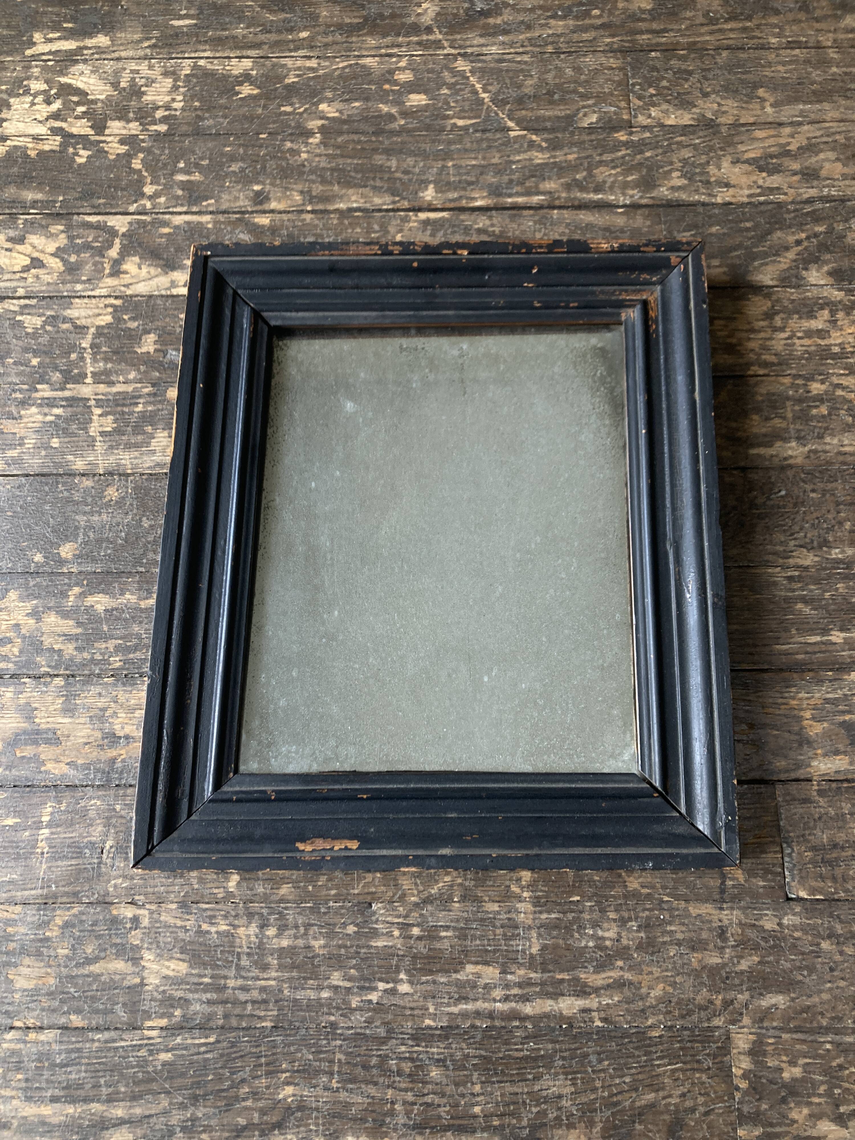 19th century blackened mirror with pitted glass 34cm x 40cm