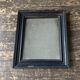 19th century blackened mirror with pitted glass 34cm x 40cm