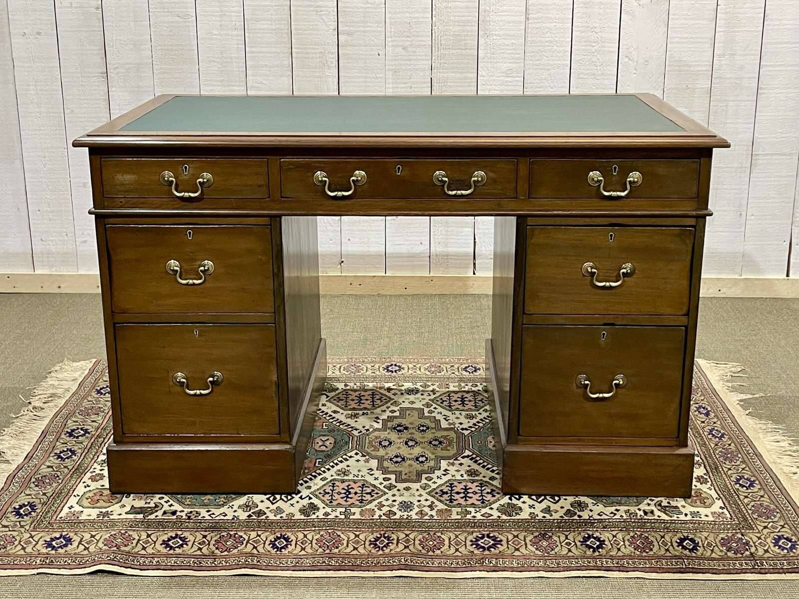 Late 19th century English mahogany desk with pedestals and leather top