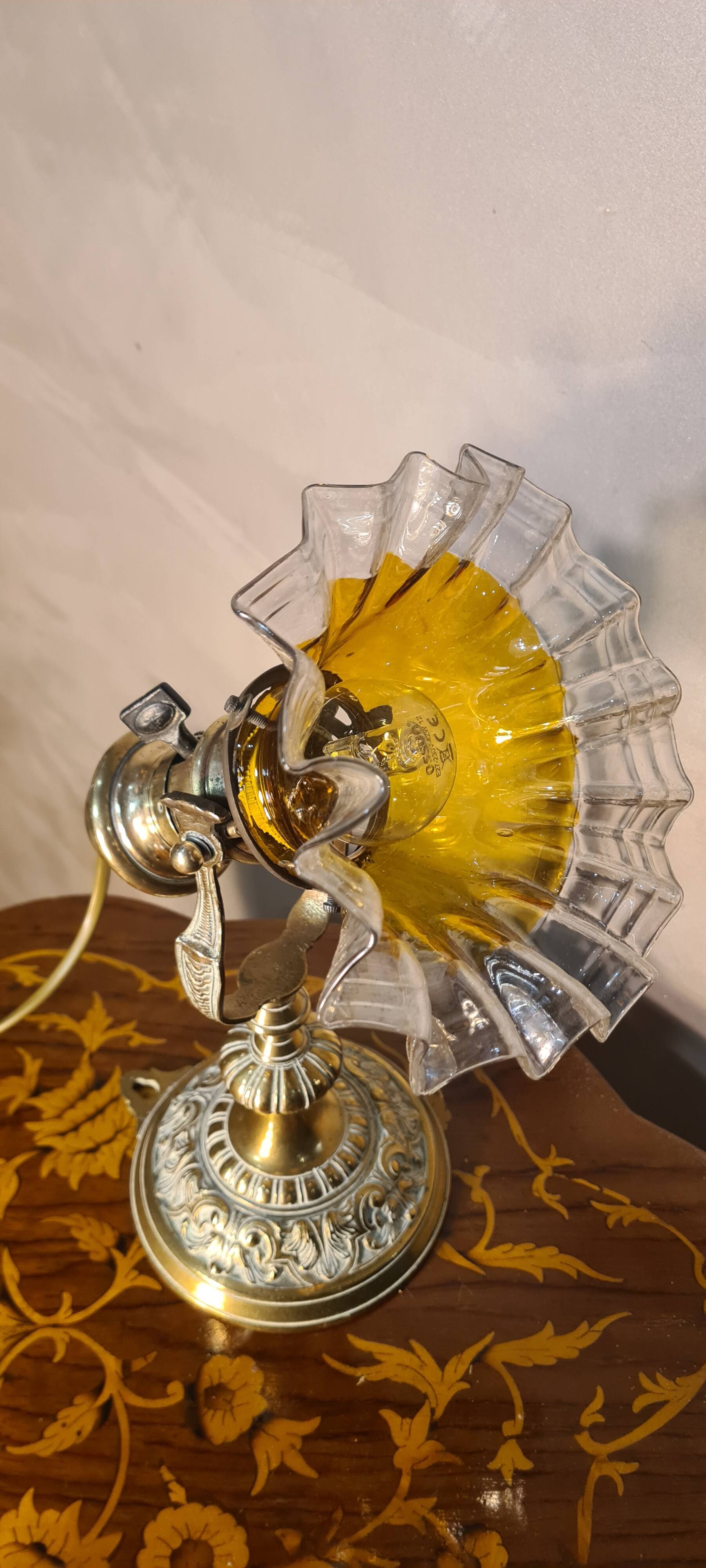 1920 bronze and brass rocking lamp with translucent amber-colored shade