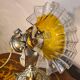 1920 bronze and brass rocking lamp with translucent amber-colored shade