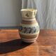 Beige carafe with stylized blue flower friezes