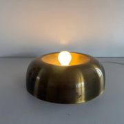 Flush-mounted disc-shaped brass fixture from the mid-century, 1960, Italy.