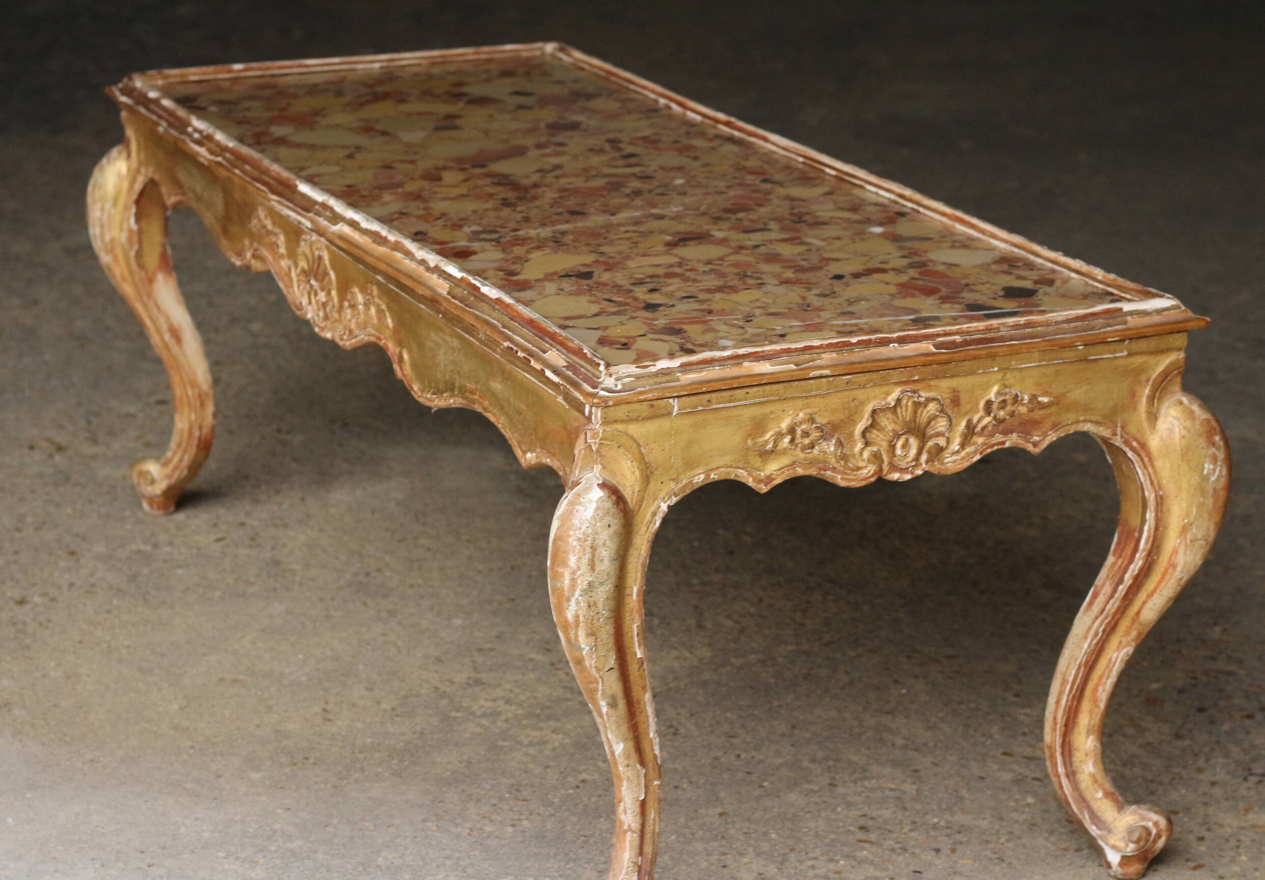 19th century coffee table. Gilded stucco and marble.
