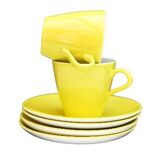 A pair of vintage bright yellow Poole Pottery - Two cups, saucers and ace