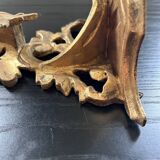 Golden console in rococo style
