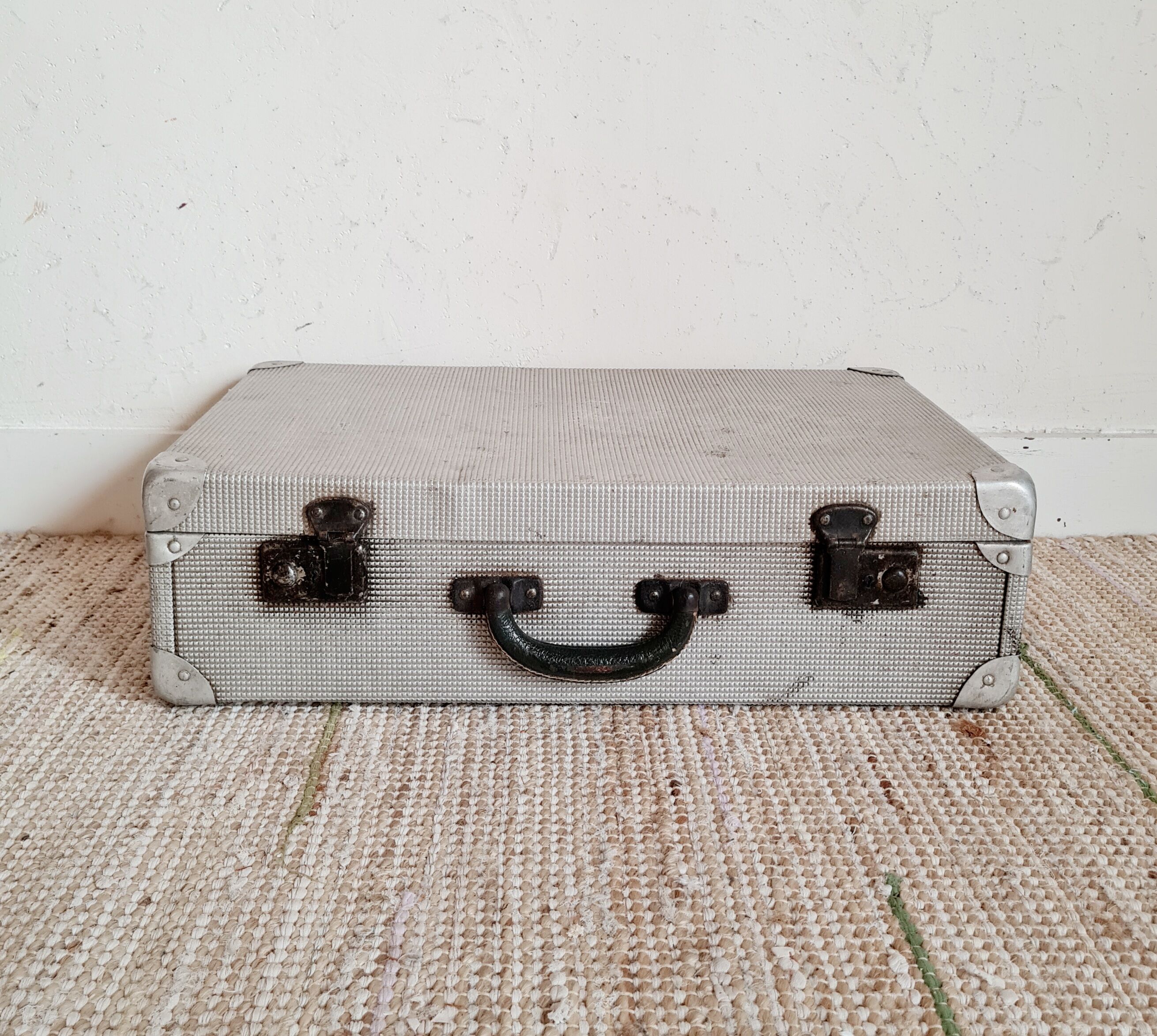 Old metal suitcase green leather handle