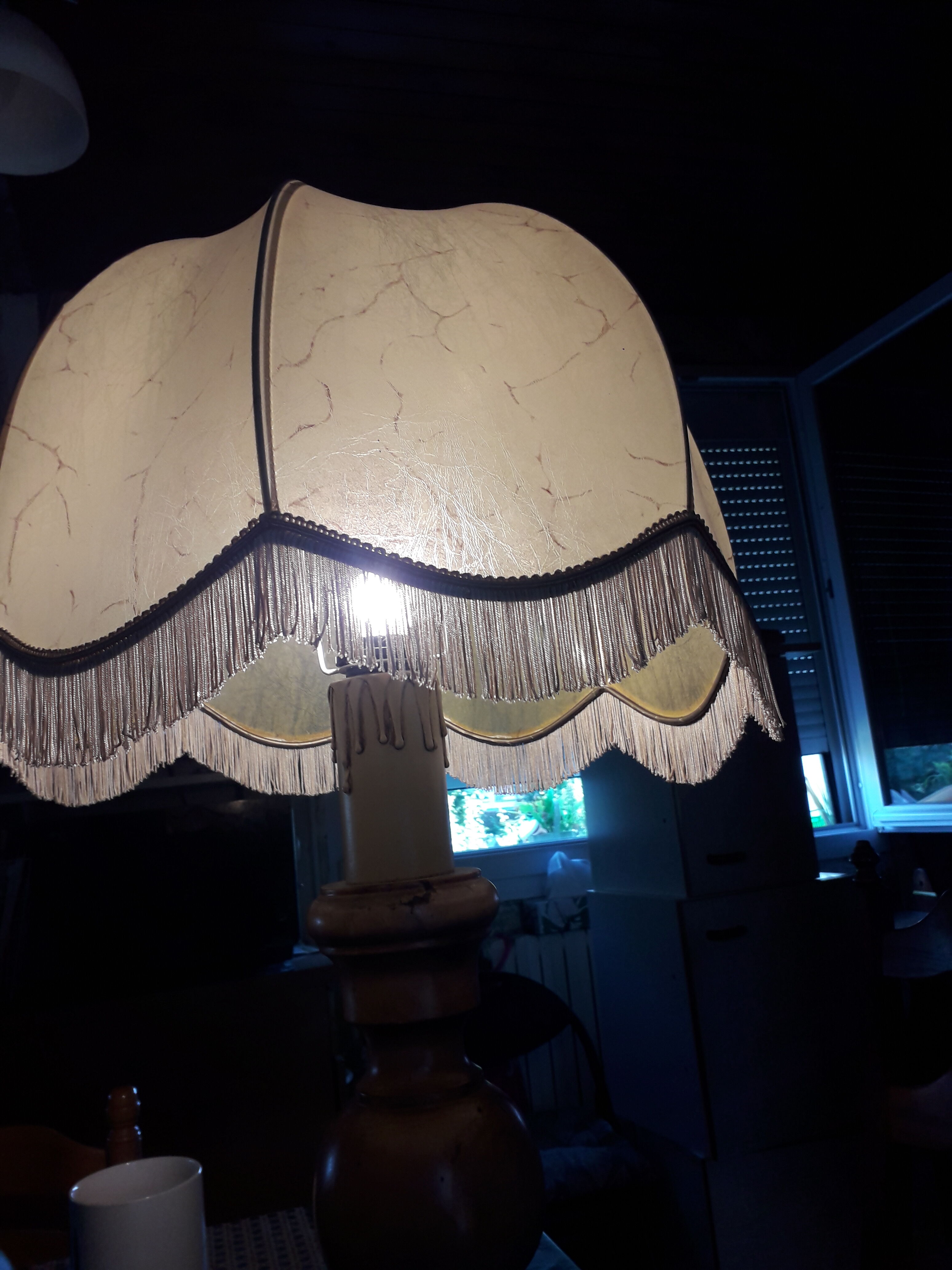 Turned wood table lamp with “skin” shade