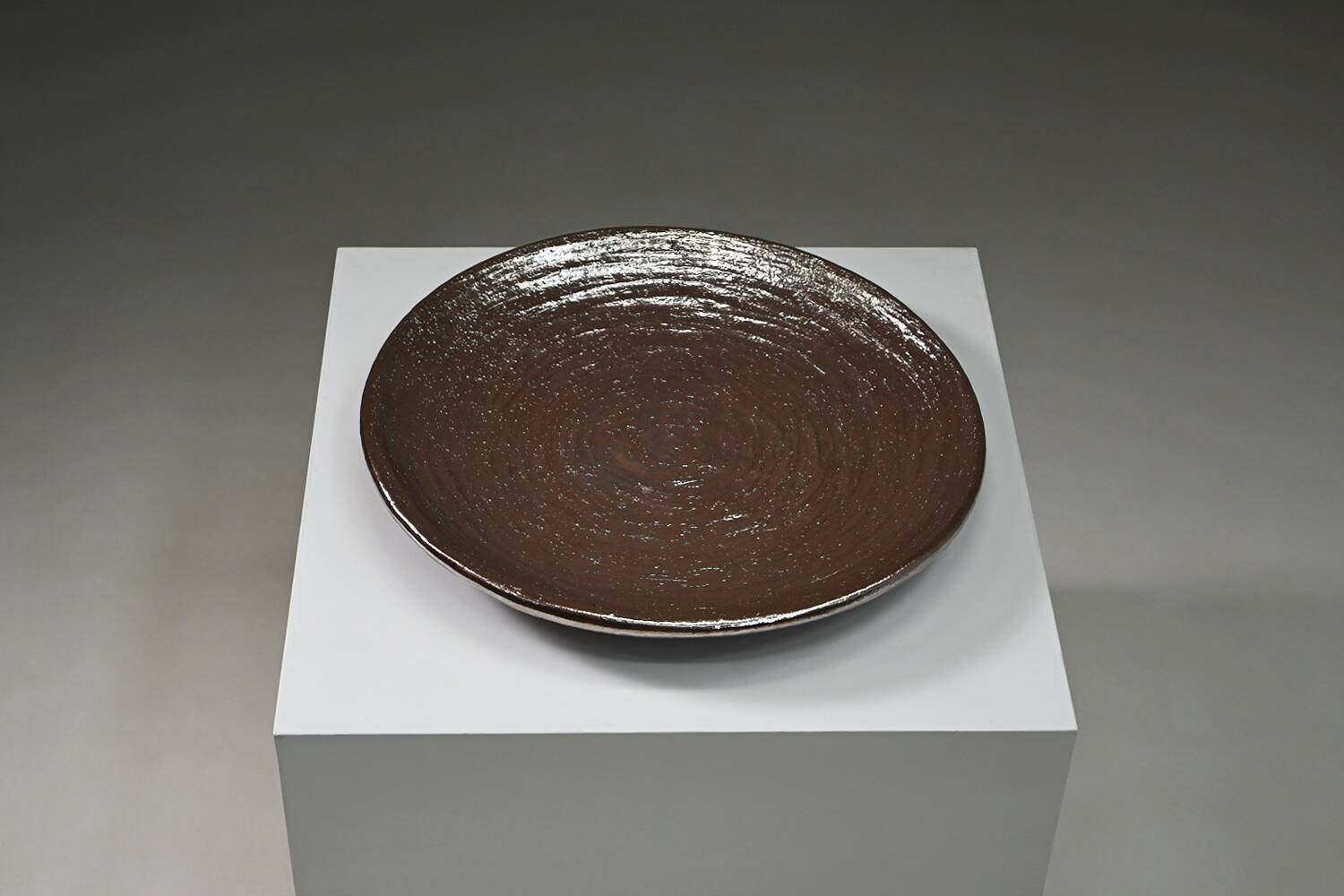 Large handmade metallic glazed ceramic bowl, circa 1980s–1990s.