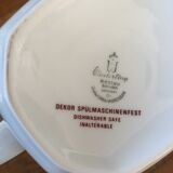 Vintage porcelain coffee or teapot with milk jug