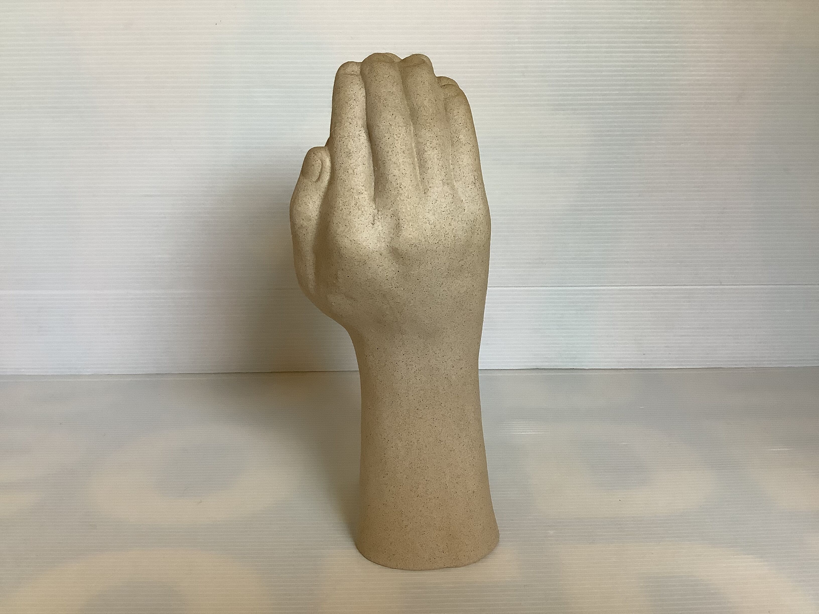 Hand-shaped candle holder