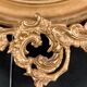 Grand miroir ovale en bois doré