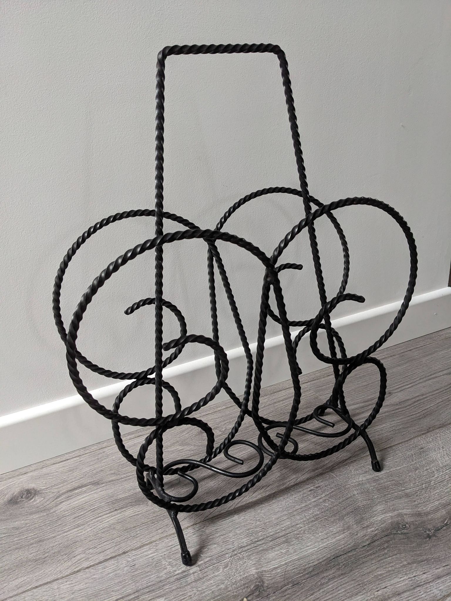Vintage wrought iron magazine rack