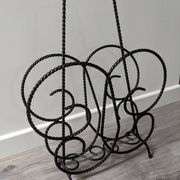 Vintage wrought iron magazine rack