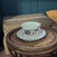 Fine porcelain breakfast cup with floral decoration, 1930-1940.