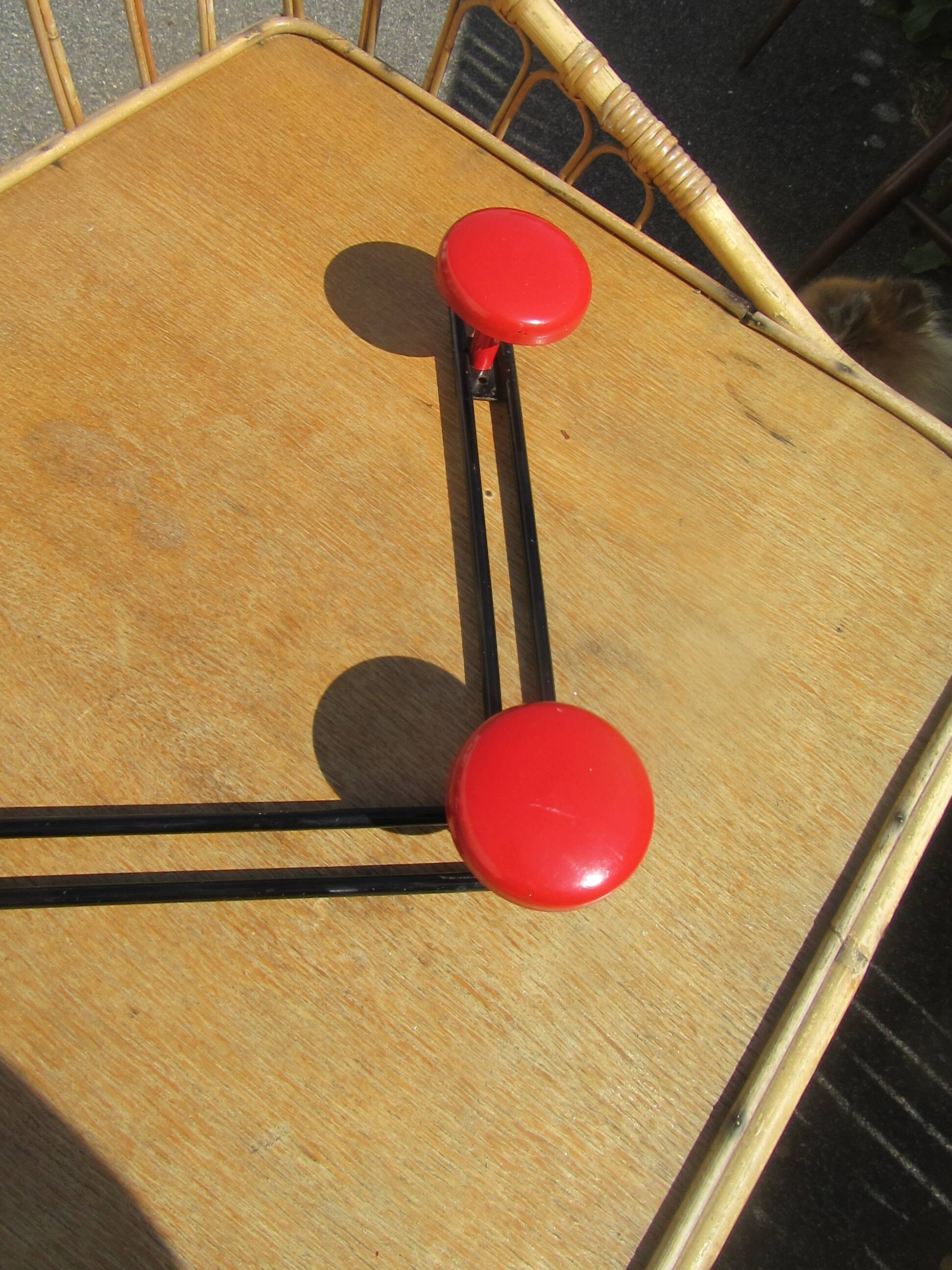 vintage black and red iron coat rack