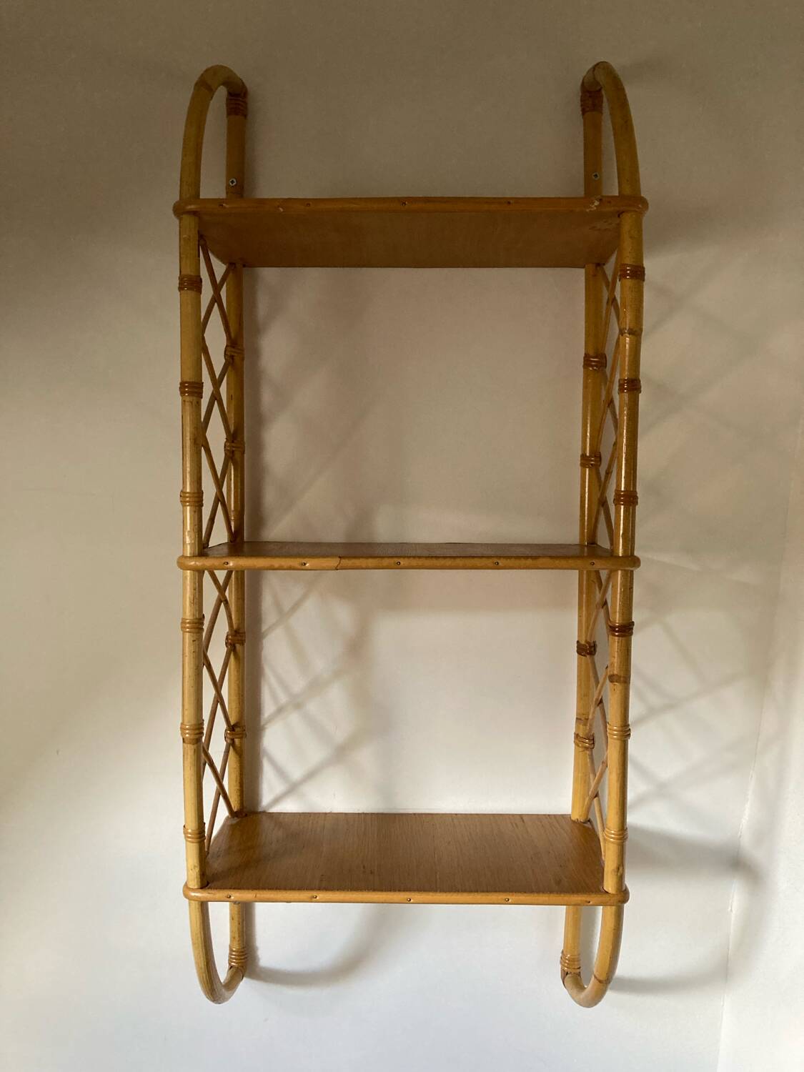 Vintage vertical wall mounted rattan shelf