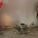 Brass candle holder cave rat peacock